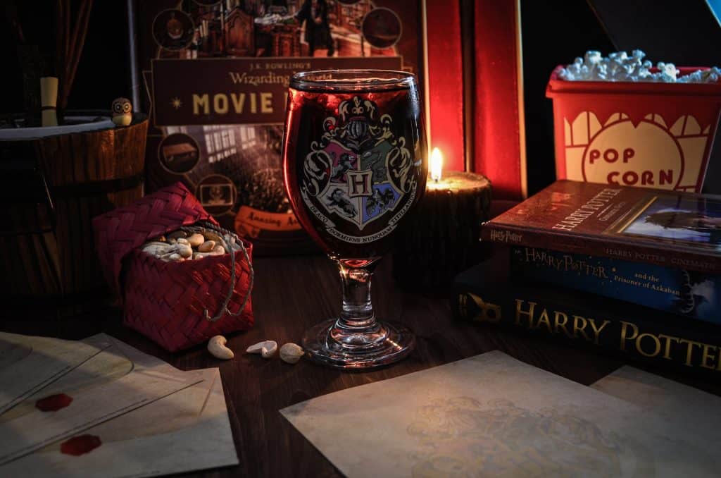 a harry potter glass sitting on top of a table