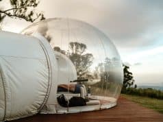 Le Glamping : L’Art du Camping de Luxe an inflatable tent on a wooden deck